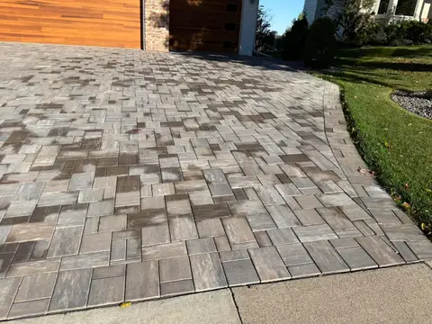 Curved paver driveway with modern design in Lakeville, MN