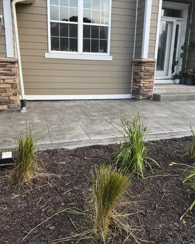 Concrete patio with ornamental grasses in Lakeville, MN