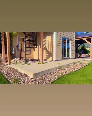 Landscaped area with stones and grass in Lakeville, MN