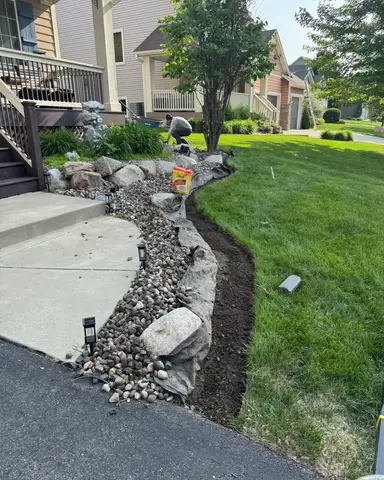 Rock border along pathway with landscaping in Lakeville, MN