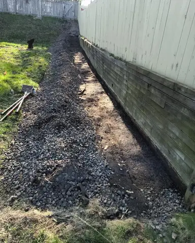 Gravel pathway with wooden retaining wall in Lakeville, MN