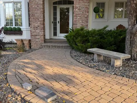 Paver walkway leading to front door with decorative stones in Lakeville, MN
