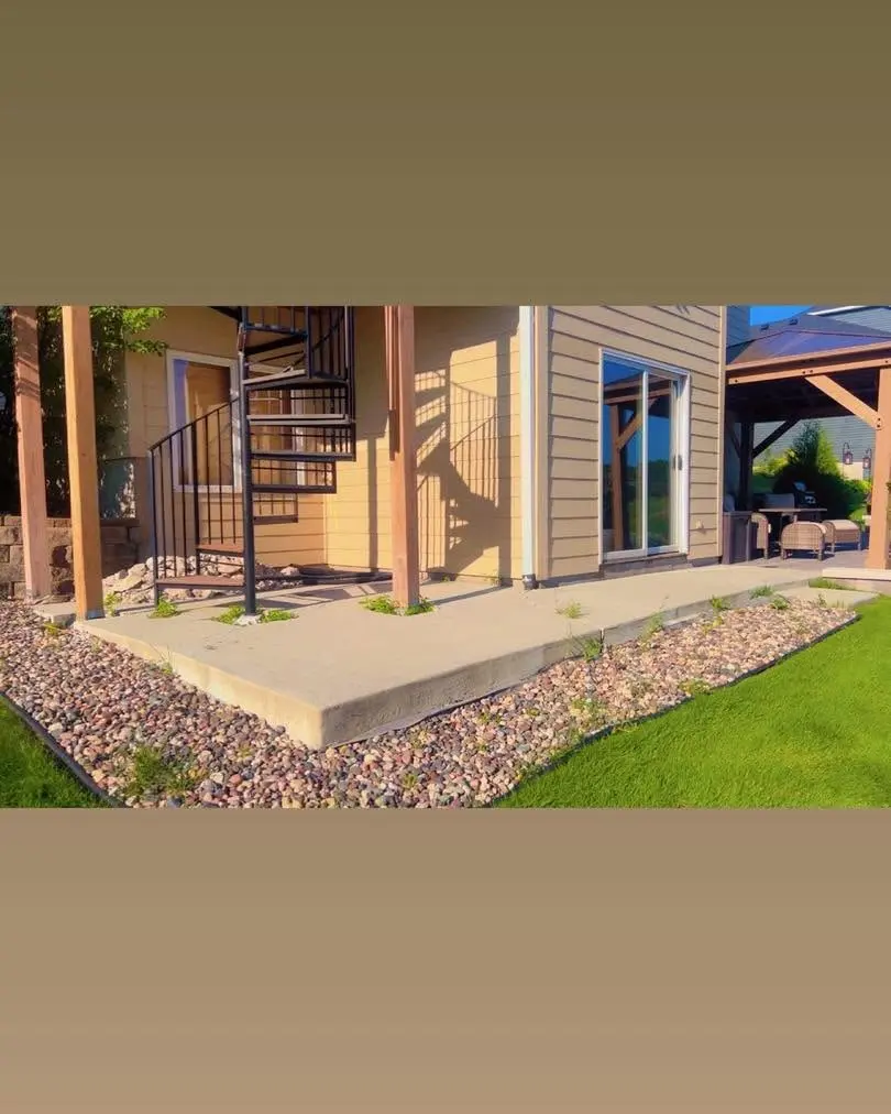 Landscaped area with stones and grass in Lakeville, MN